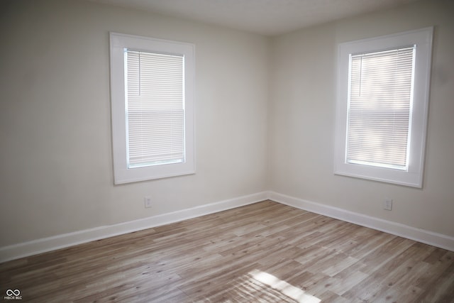 spare room featuring light wood-type flooring