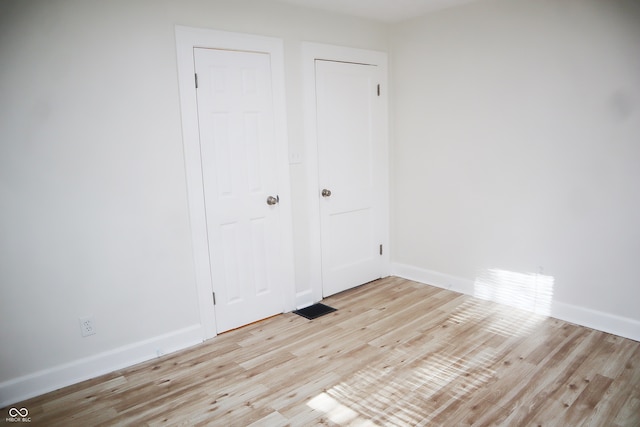 empty room with light wood-type flooring