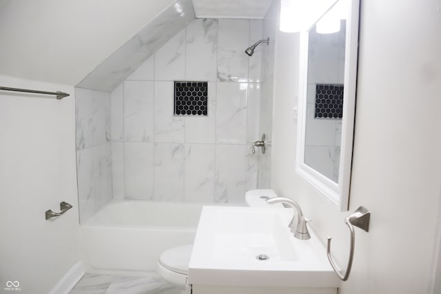 full bathroom with tiled shower / bath combo, vanity, and toilet