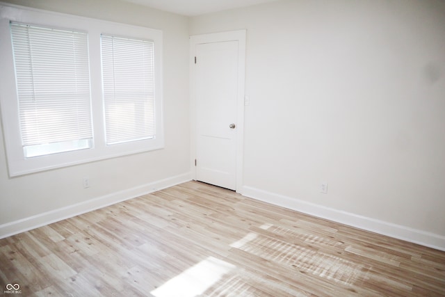 empty room with light wood-type flooring