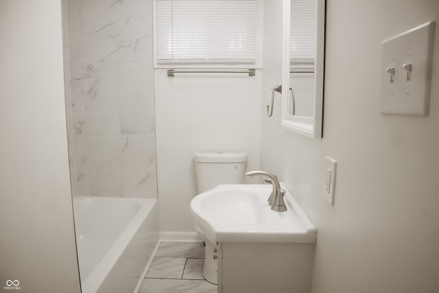 full bathroom with tiled shower / bath combo, vanity, and toilet