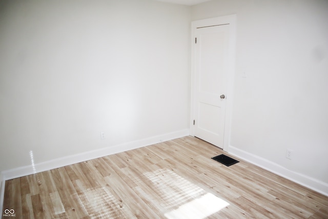 spare room featuring light hardwood / wood-style floors