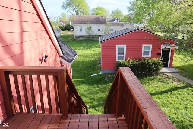 wooden deck with a lawn