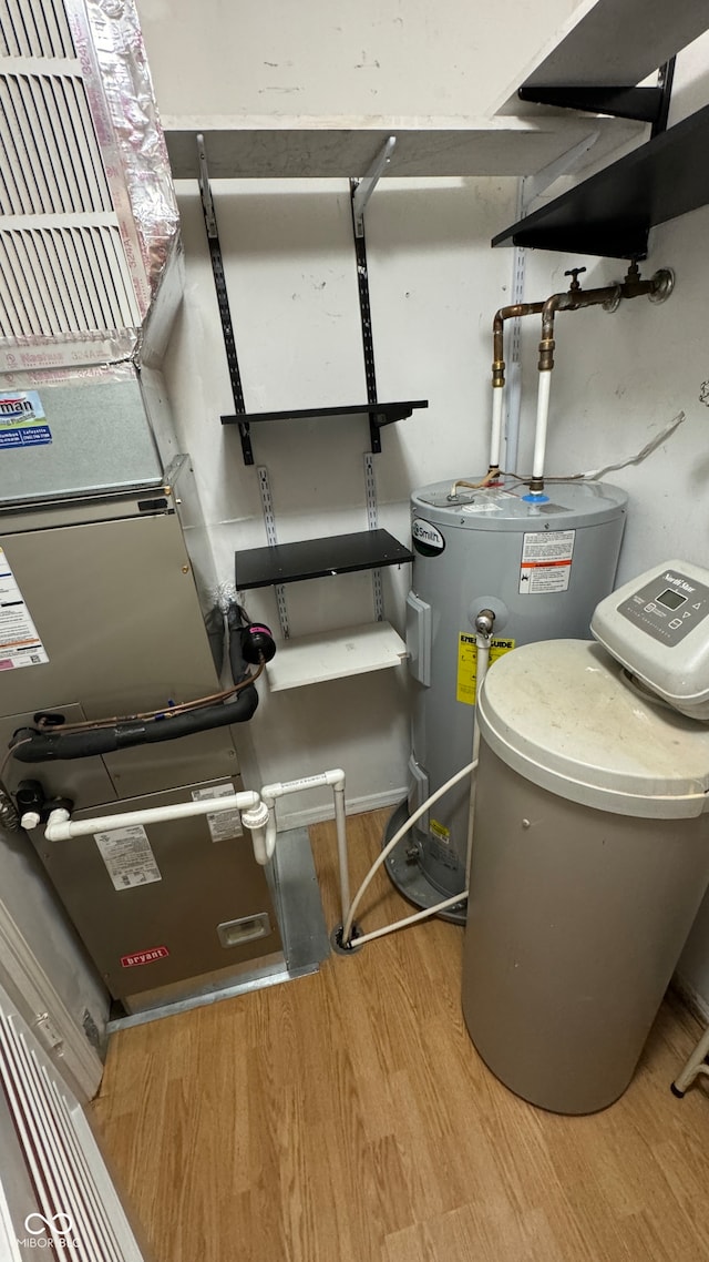 utility room featuring electric water heater