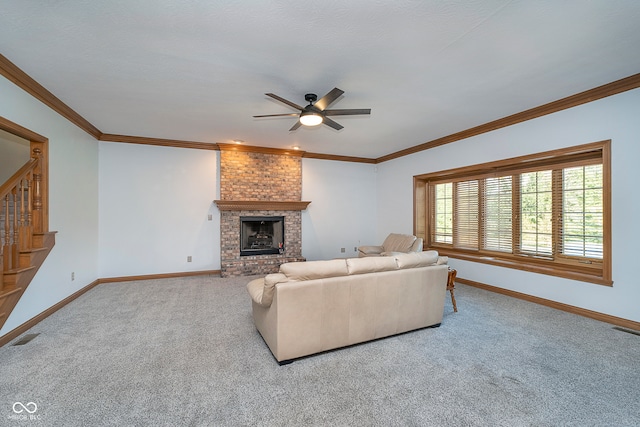 living room featuring ornamental molding, a brick fireplace, carpet, and ceiling fan