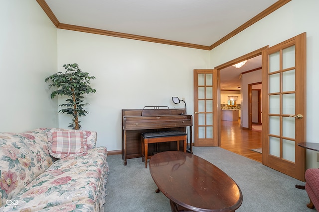 living room with light colored carpet, french doors, and crown molding