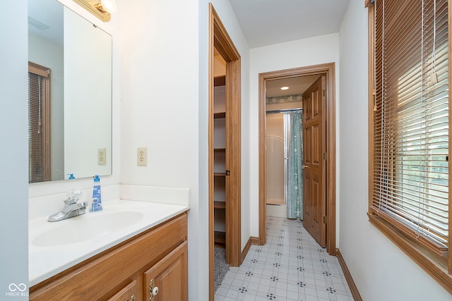 bathroom featuring vanity and a wealth of natural light