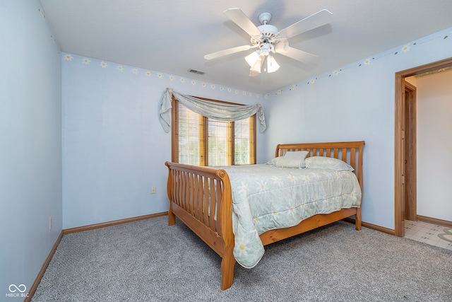 bedroom with ceiling fan and carpet flooring