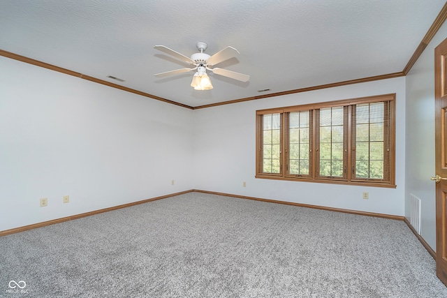 spare room with ceiling fan, a textured ceiling, and carpet flooring