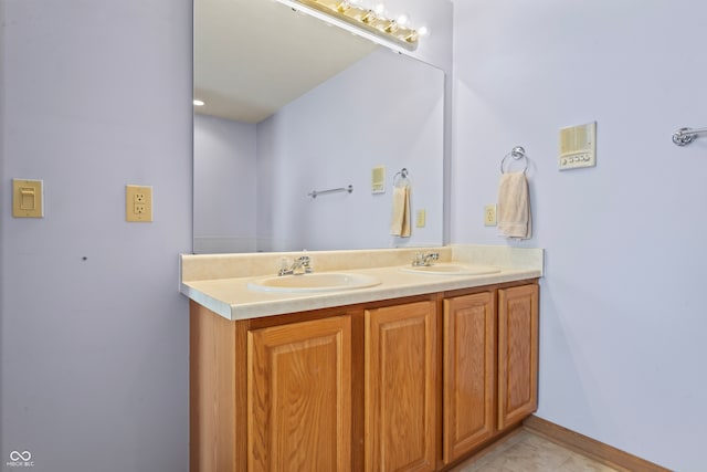 bathroom featuring tile patterned flooring and vanity