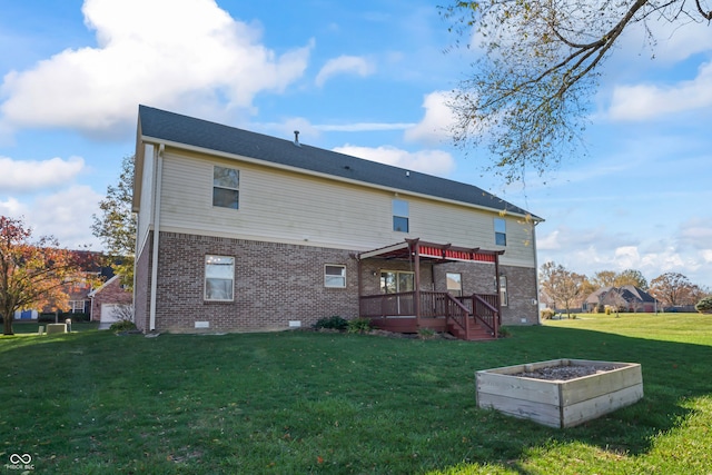 back of house featuring a yard and a deck