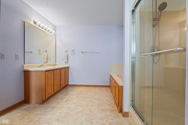 bathroom with separate shower and tub and vanity