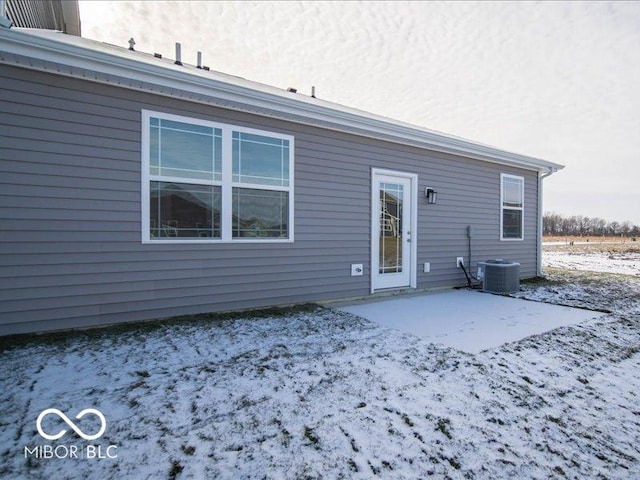 back of house with central AC and a patio