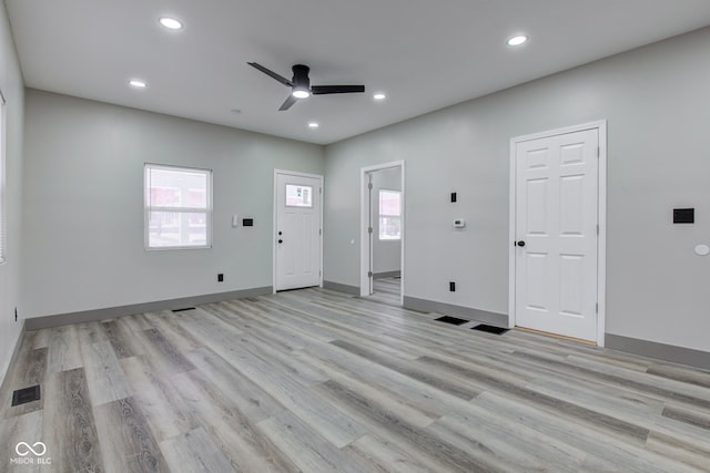 interior space with light wood-type flooring and ceiling fan