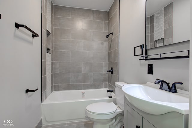 full bathroom with vanity, toilet, and tiled shower / bath