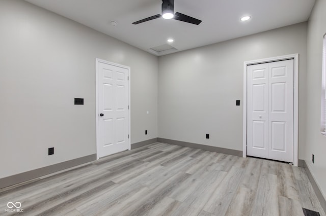 empty room featuring ceiling fan and light hardwood / wood-style floors