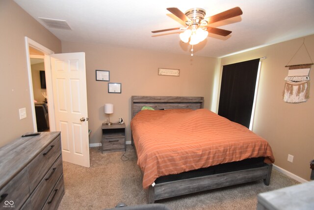 bedroom with ceiling fan and carpet