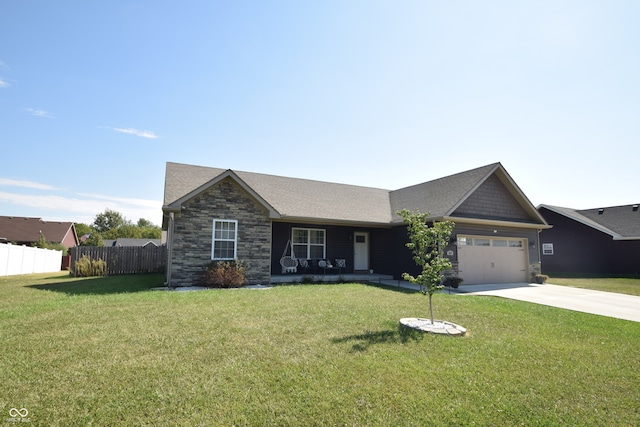 view of front facade with a front yard and a garage