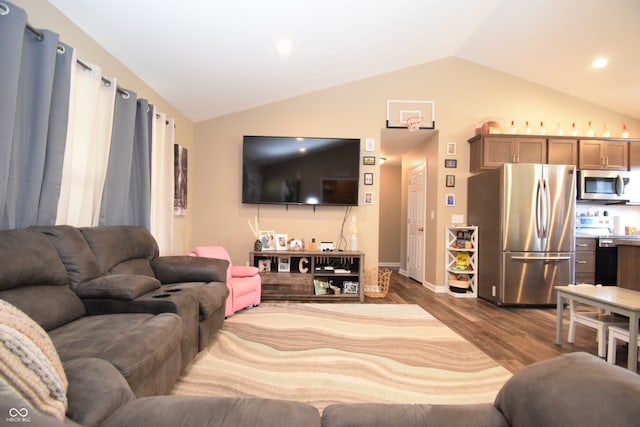 living room featuring dark wood-type flooring and vaulted ceiling