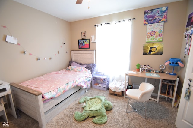 bedroom with ceiling fan, carpet, and multiple windows