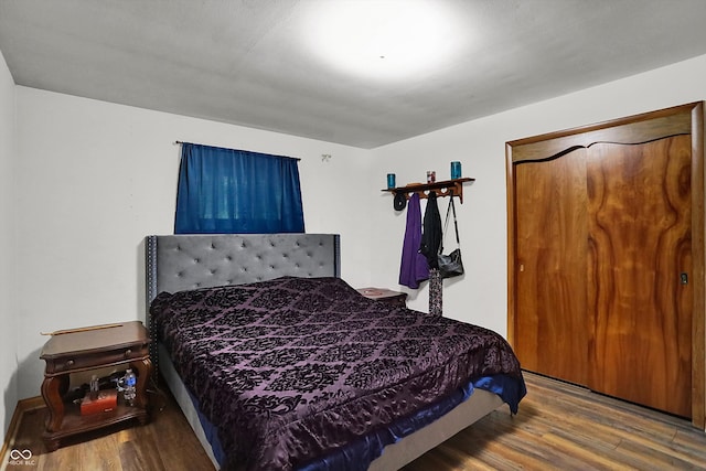 bedroom with wood-type flooring