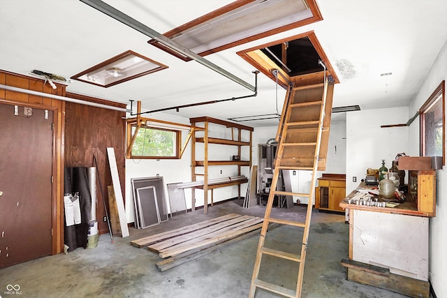 garage featuring wooden walls