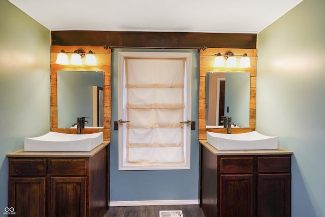 bathroom featuring hardwood / wood-style flooring and vanity