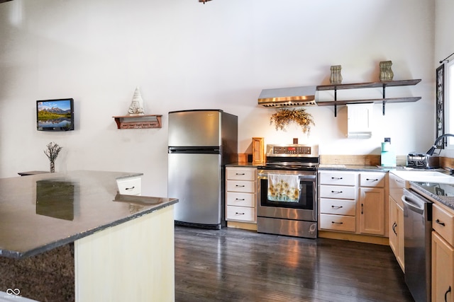 kitchen with light brown cabinets, sink, range hood, appliances with stainless steel finishes, and dark hardwood / wood-style flooring