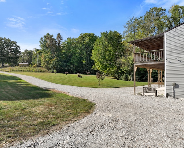 surrounding community featuring a lawn and a deck