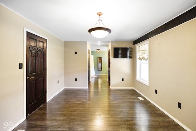 spare room featuring dark hardwood / wood-style floors