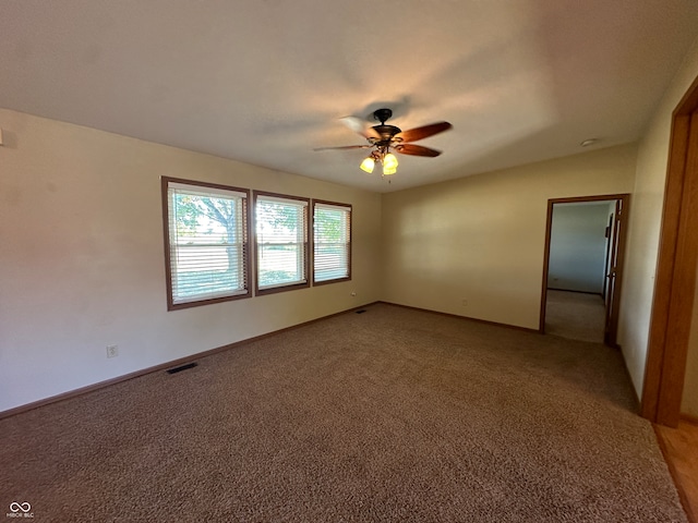 empty room with carpet and ceiling fan