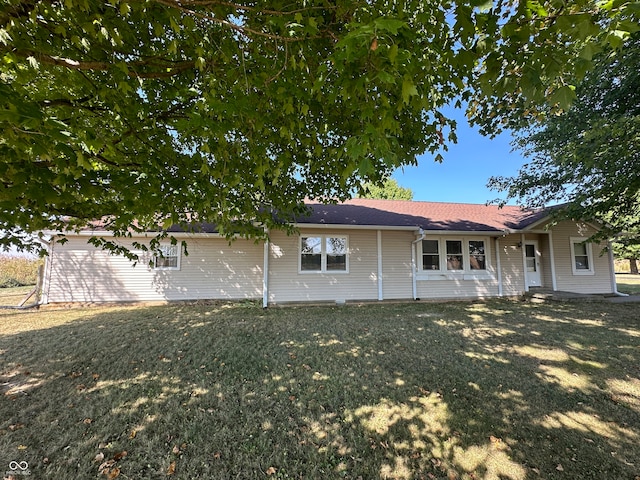 ranch-style house with a front lawn