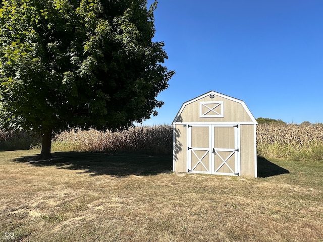 view of outbuilding featuring a yard