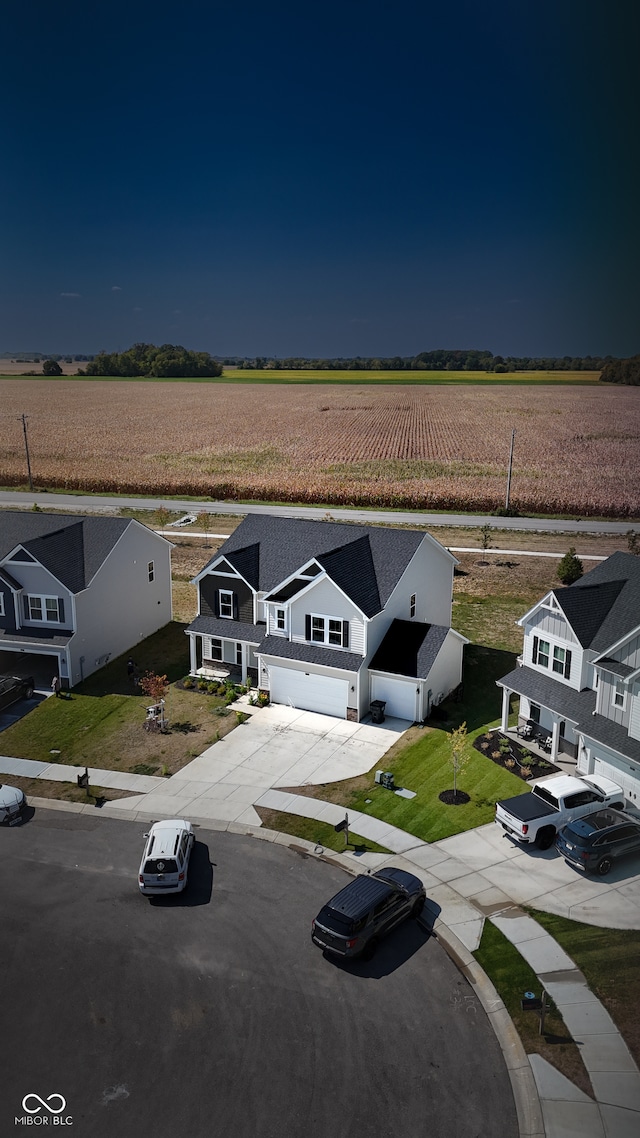 birds eye view of property featuring a rural view