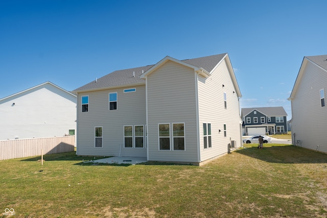 rear view of house with a lawn