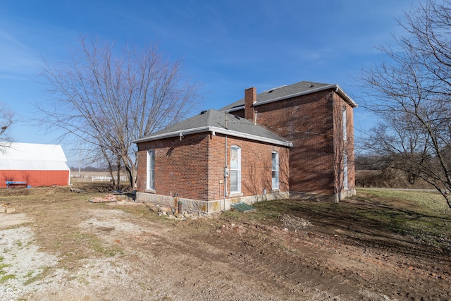 9517 N 550 W, Carthage, IN 46115 - view of property exterior with a chimney and brick siding