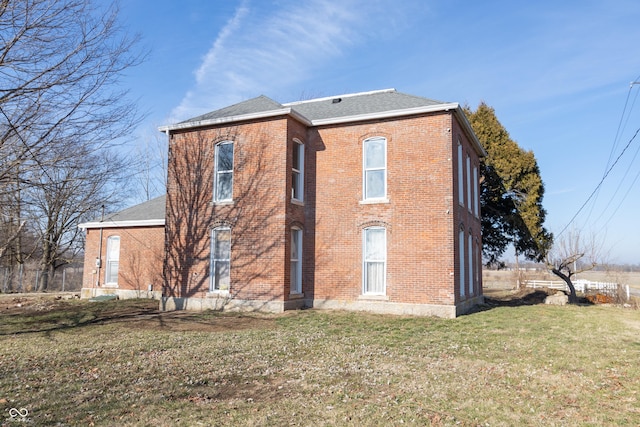 9517 N 550 W, Carthage, IN 46115 - exterior space with a front yard, brick siding, and roof with shingles