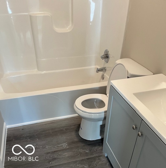 full bathroom with wood-type flooring, vanity, toilet, and shower / bathing tub combination