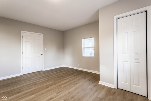 unfurnished bedroom featuring light wood-type flooring