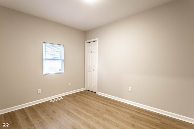 unfurnished room with light hardwood / wood-style floors