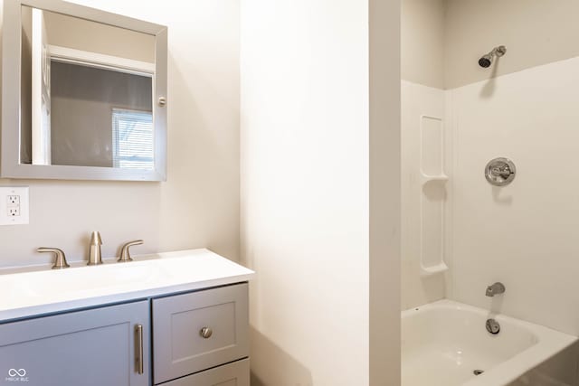 bathroom featuring tub / shower combination and vanity