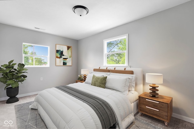 bedroom with light carpet