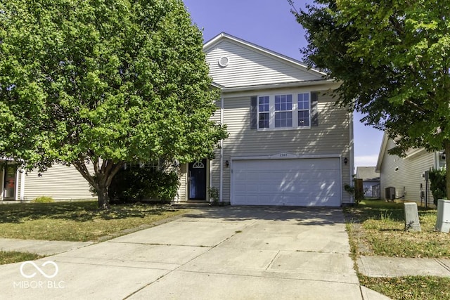 2307 Blackthorn Dr, Franklin, IN 46131 - view of front of house with an attached garage, driveway, and central AC unit