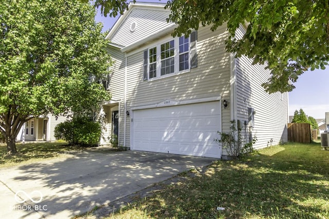2307 Blackthorn Dr, Franklin, IN 46131 - view of side of home with a garage, driveway, and cooling unit