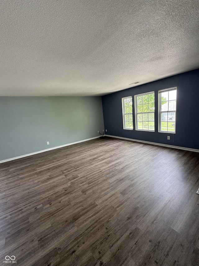 2307 Blackthorn Dr, Franklin, IN 46131 - unfurnished room with dark wood-type flooring, a textured ceiling, and baseboards