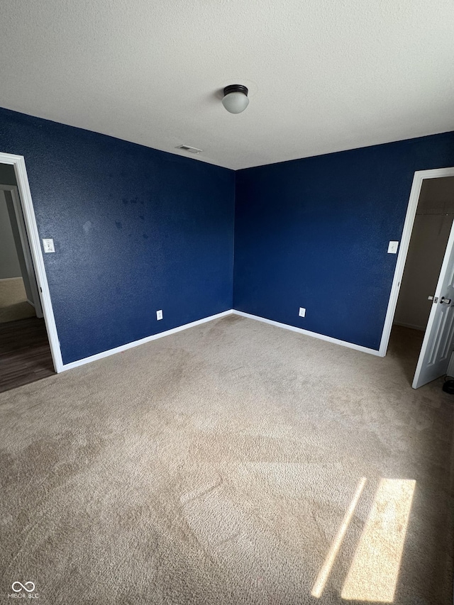 2307 Blackthorn Dr, Franklin, IN 46131 - spare room featuring carpet, baseboards, and a textured ceiling