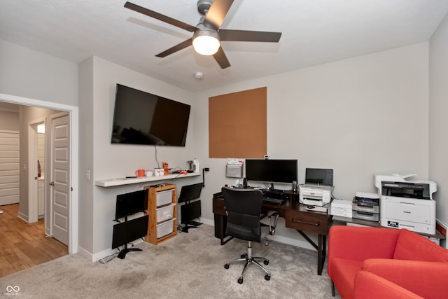 office space featuring ceiling fan and light hardwood / wood-style floors