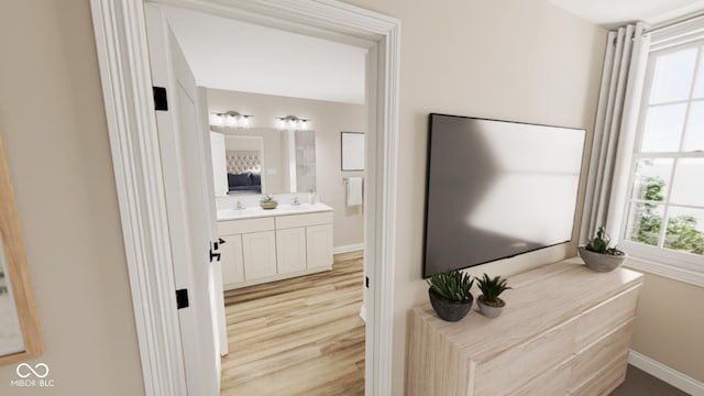 bathroom featuring wood-type flooring and vanity