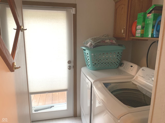 laundry area with cabinets and washer and dryer