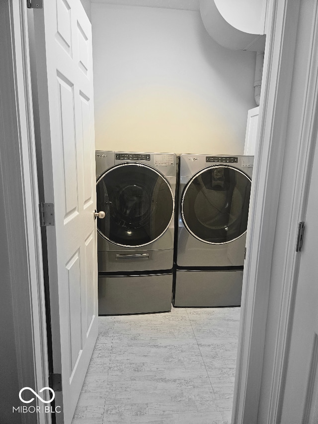 washroom featuring independent washer and dryer